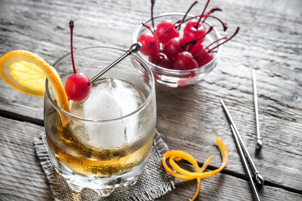 Old Fashioned Drink with Cherries and Tools