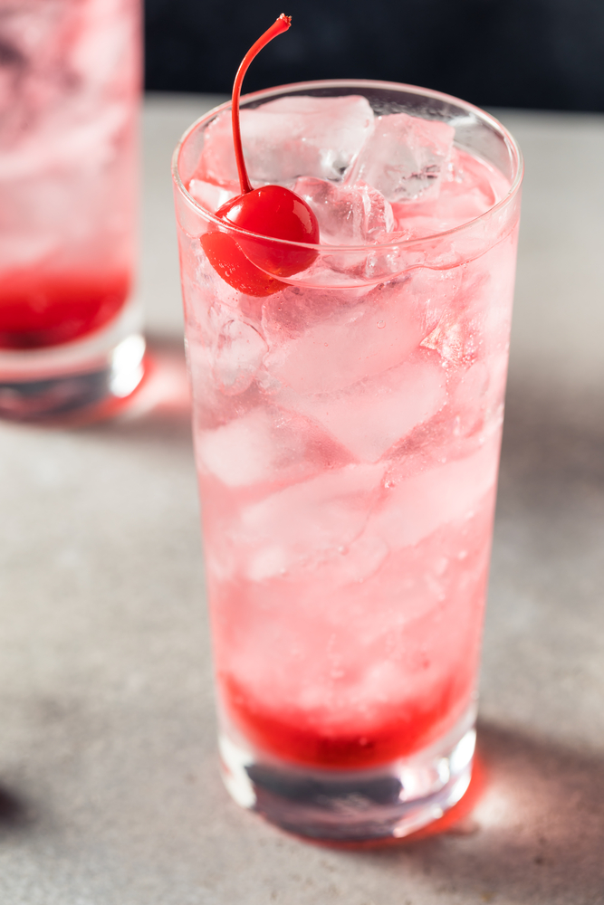 Dirty Shirley Cocktail Glass with Cherry and Grenadine