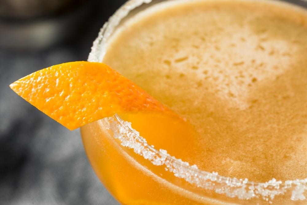 Closeup of Sidecar Drink Cocktail with Orange Twist and Sugar Rim