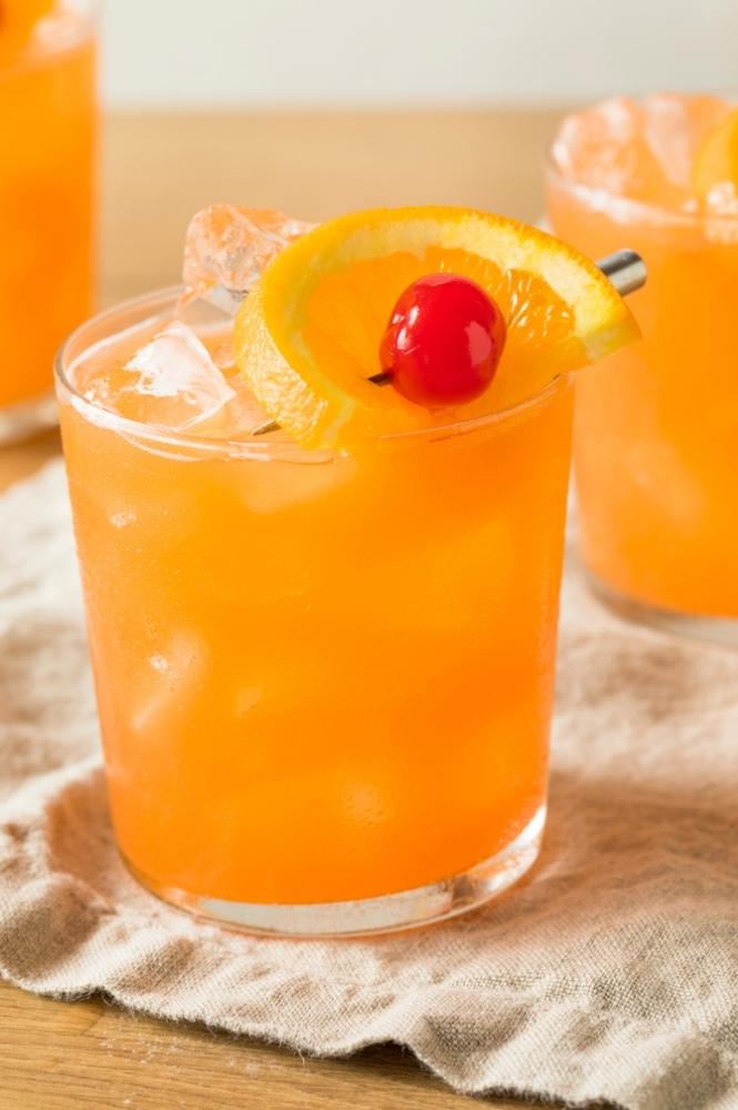 Glass of Amaretto Stone Sour Cocktail Recipe Includes Orange and Cherry