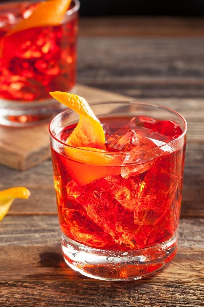 Closeup of Negroni Cocktail On Wood Counter