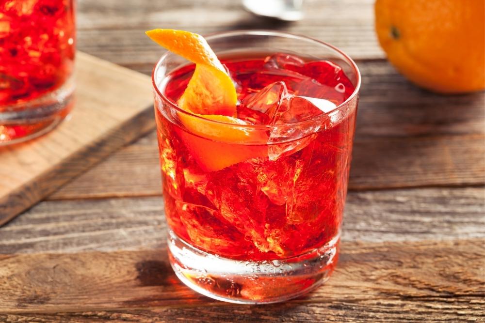 Negroni Cocktail on Wood with Orange