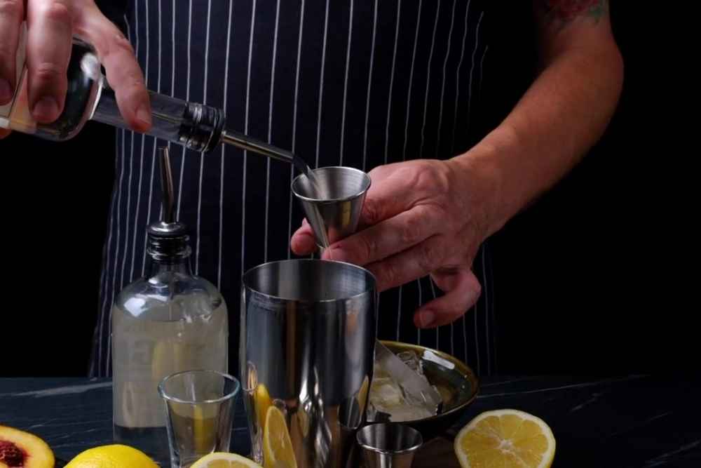 Pouring Vodka Into Cocktail Shaker