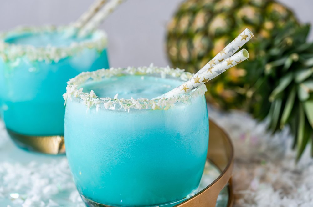 Blue Jack Frost Cocktail with Straws and Pineapple