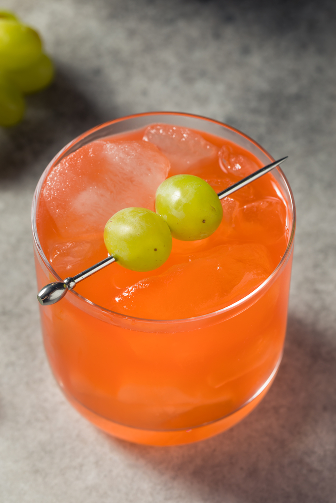 Closeup of Enzoni Cocktail Drink with Grape Garnish