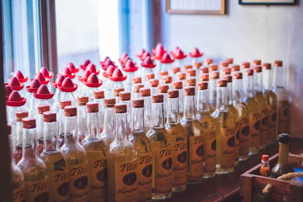 Many Different Tito's Handmade Vodka Bottles in Rows