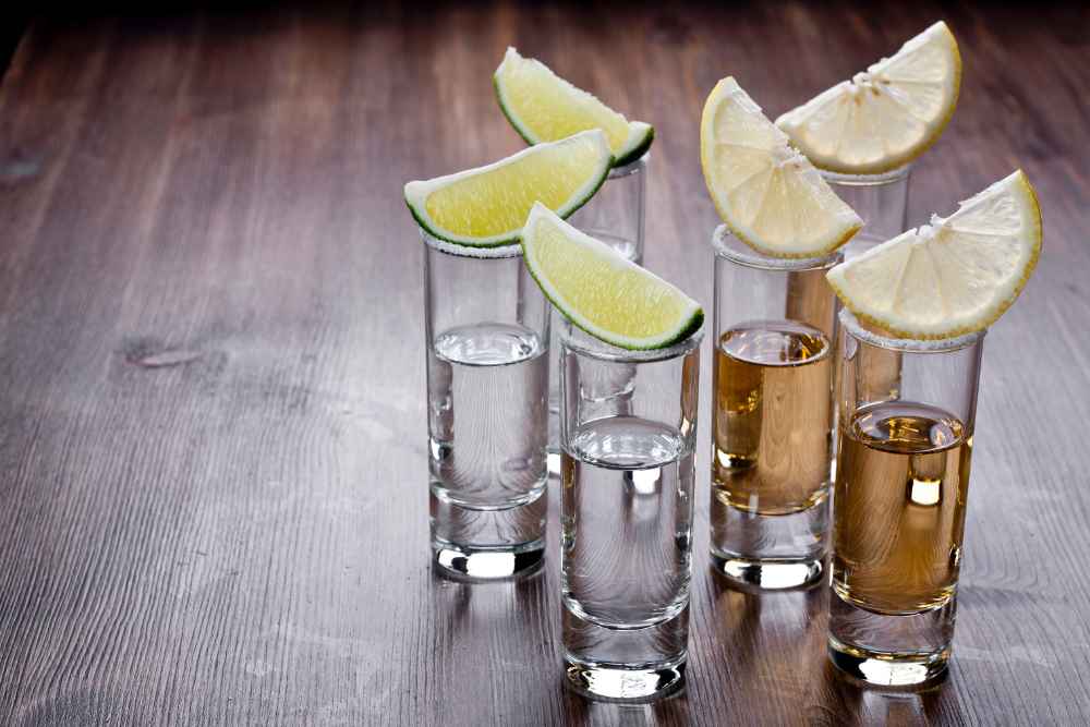White and Dark Tequila Shots with Limes