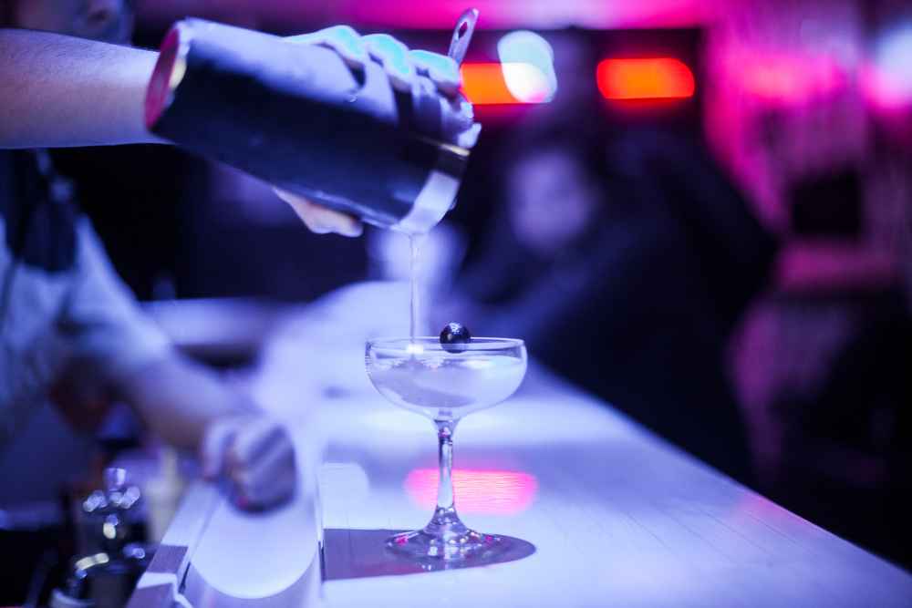 Bartender Pouring Grey Goose Vodka Cocktail From Shaker