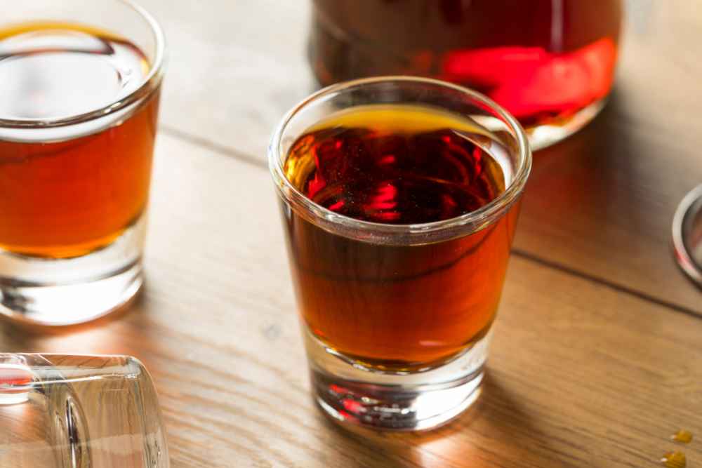 What is Sloe Gin - Red Liquor in Shot Glasses with Bottle