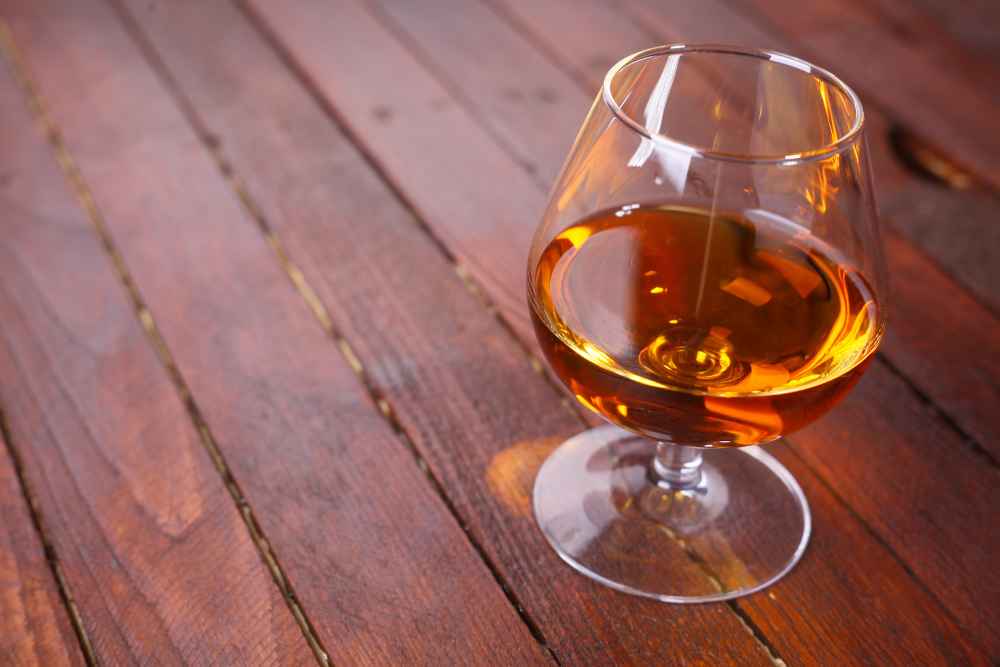 Glass of Brandy on Wood