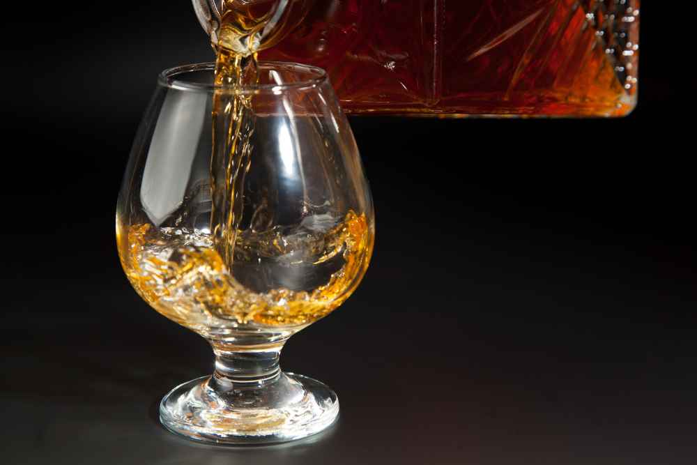 Pouring Pierre Ferrand Cognac Into Glass